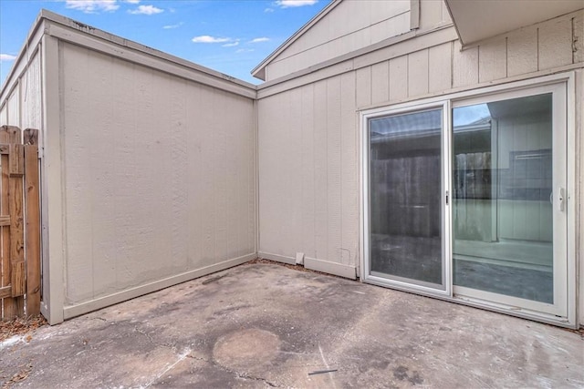 view of patio / terrace featuring fence