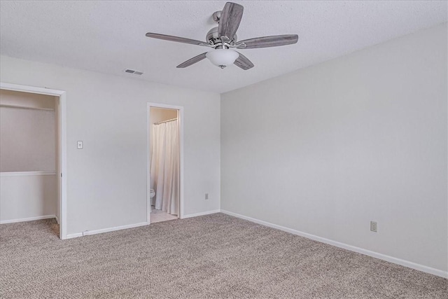 unfurnished bedroom featuring baseboards, visible vents, and light colored carpet