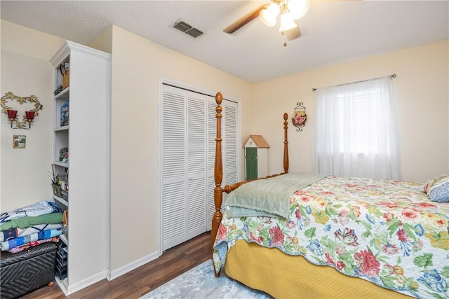 bedroom with a closet, ceiling fan, and dark wood-type flooring