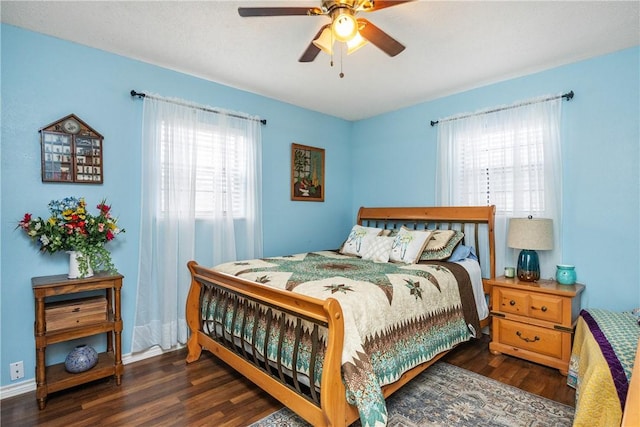 bedroom with ceiling fan and dark wood-type flooring