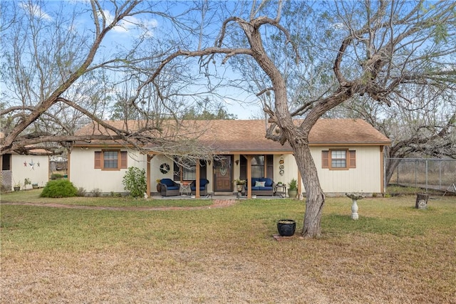 single story home featuring an outdoor living space and a front lawn