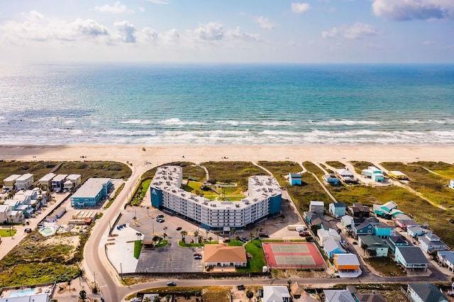 drone / aerial view with a beach view and a water view