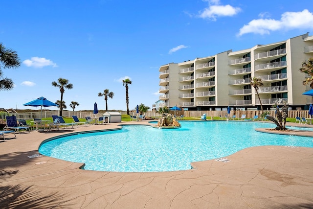 view of swimming pool with a patio area