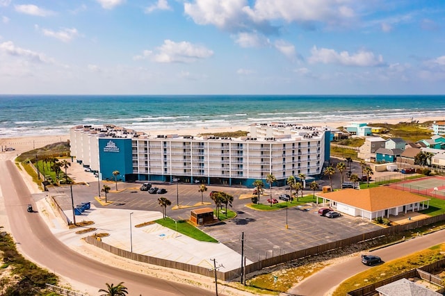 drone / aerial view with a beach view and a water view