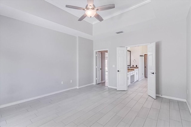 empty room featuring light wood-type flooring and ceiling fan