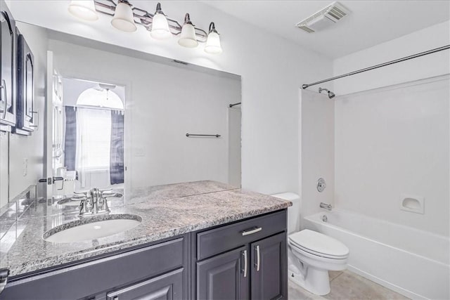 full bathroom featuring shower / washtub combination, tile patterned flooring, vanity, and toilet