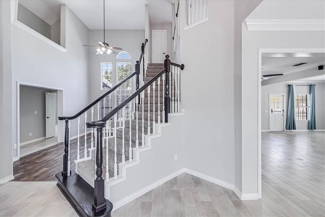 10 W Bar Le Doc Dr, Corpus Christi, TX 78414 - stairway featuring a ceiling fan and wood finished floors