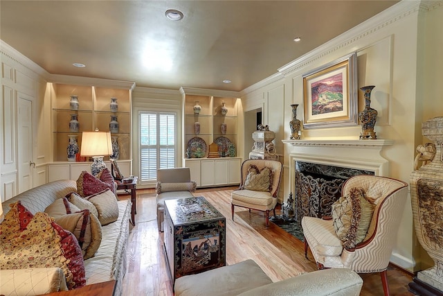 215 Oleander, Corpus Christi, TX 78404 - living area featuring ornamental molding, built in features, a premium fireplace, wood finished floors, and recessed lighting