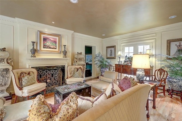 215 Oleander, Corpus Christi, TX 78404 - living room featuring wood finished floors, a decorative wall, a fireplace, and crown molding