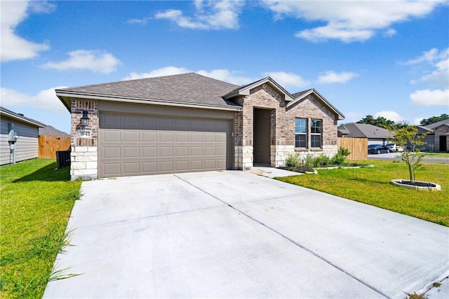 view of front of property featuring a garage, concrete driveway, fence, and a front lawn