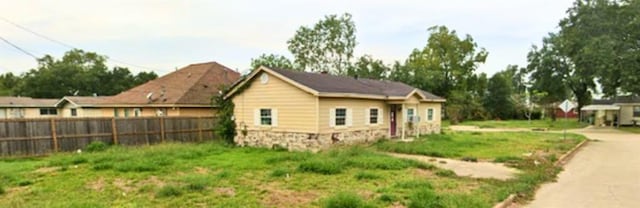 view of property exterior with fence