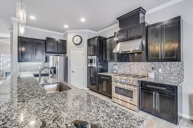 kitchen with stone counters, sink, stainless steel appliances, pendant lighting, and ornamental molding