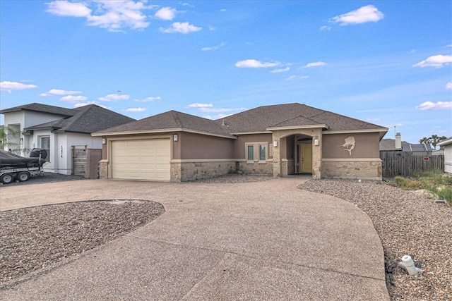 prairie-style house featuring a garage