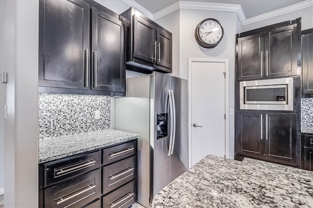 kitchen with light stone countertops, crown molding, appliances with stainless steel finishes, and tasteful backsplash