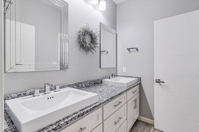 bathroom featuring wood-type flooring and vanity