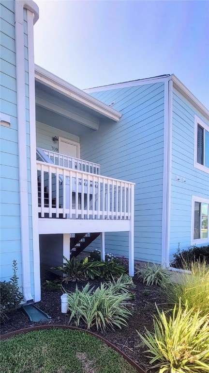 view of home's exterior featuring a wooden deck