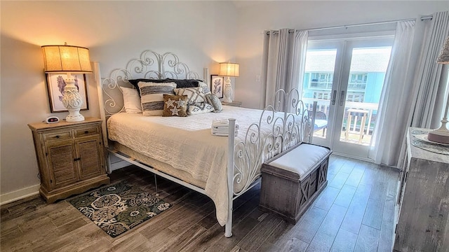 bedroom featuring french doors, access to exterior, and dark hardwood / wood-style flooring