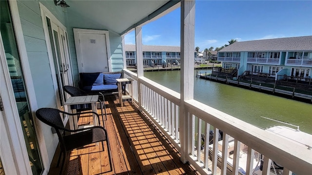 balcony featuring a water view