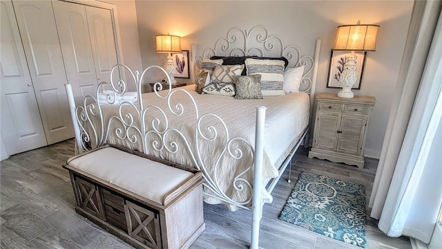 bedroom featuring a closet and hardwood / wood-style flooring