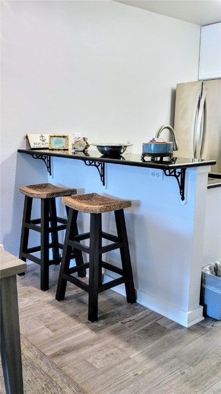 dining area with light hardwood / wood-style flooring