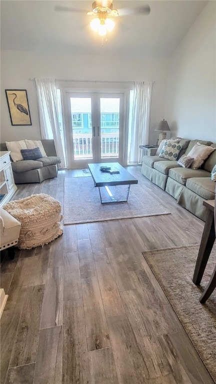 living room with hardwood / wood-style floors and ceiling fan