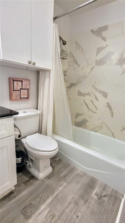 full bathroom featuring hardwood / wood-style flooring, vanity, toilet, and shower / bath combination with curtain