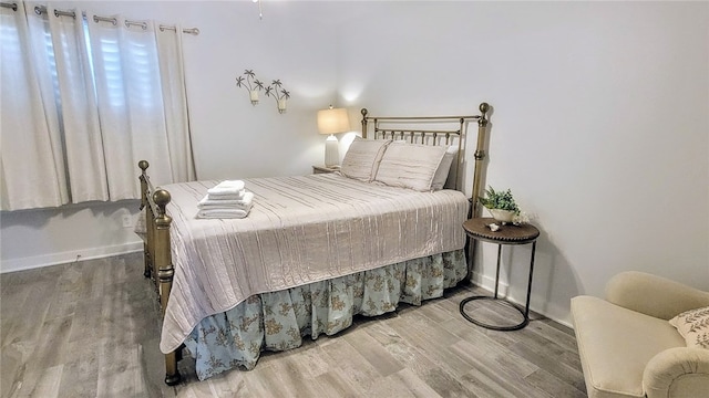 bedroom featuring hardwood / wood-style flooring