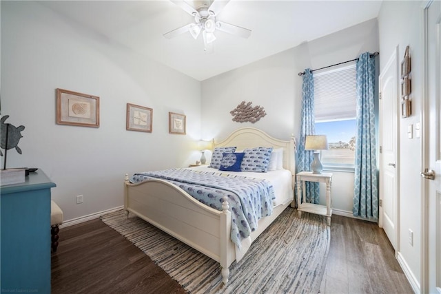 bedroom featuring ceiling fan and dark hardwood / wood-style floors