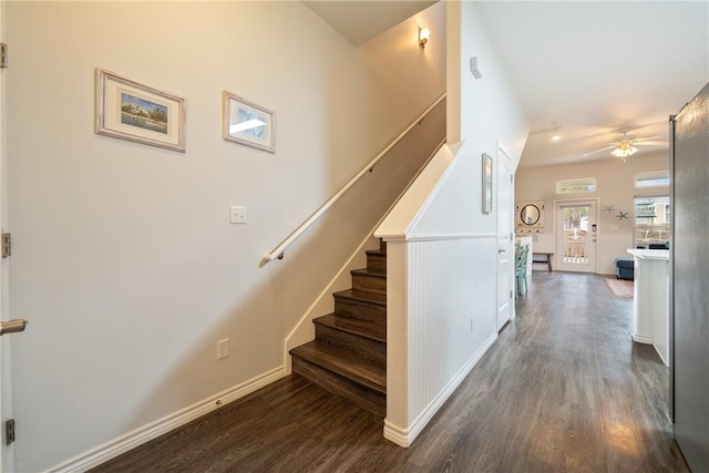 stairway featuring hardwood / wood-style floors and ceiling fan