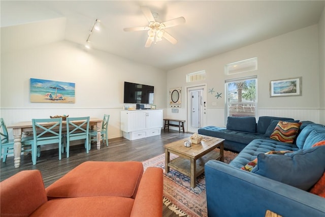 living room with rail lighting, vaulted ceiling, ceiling fan, and dark wood-type flooring