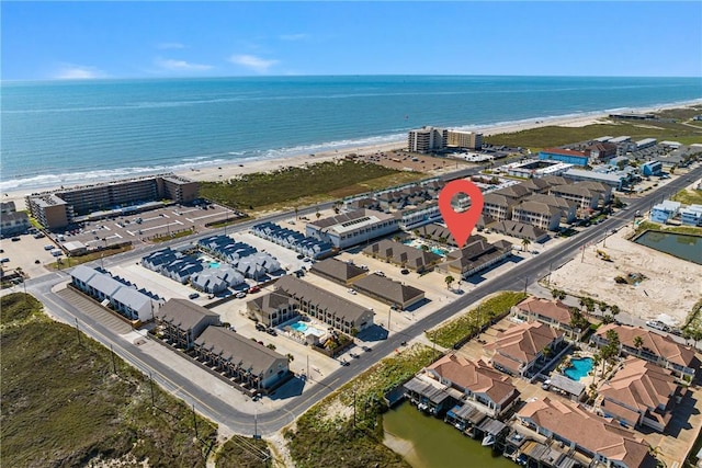 drone / aerial view with a water view and a view of the beach