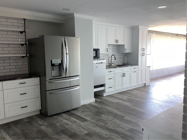 kitchen with dishwasher, sink, stainless steel fridge with ice dispenser, and white cabinets