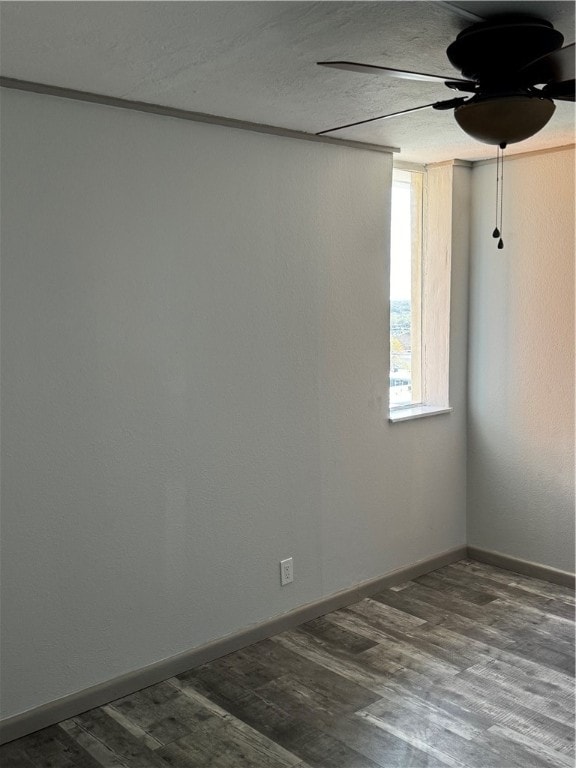 spare room with wood-type flooring, ceiling fan, and a textured ceiling