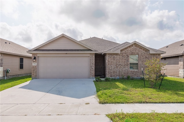 ranch-style house featuring a garage and a front yard