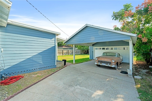 garage featuring a yard and a carport