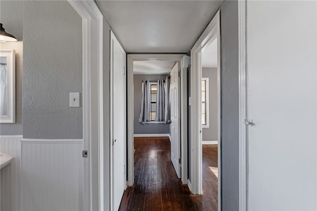 hall with dark hardwood / wood-style floors