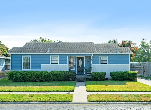 ranch-style home with a front yard