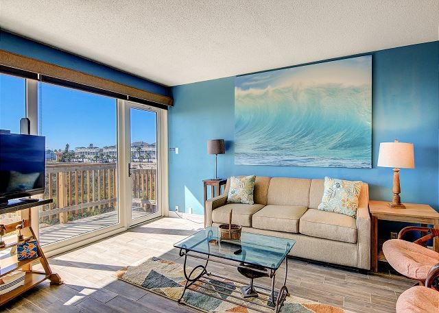 living room with hardwood / wood-style floors and a textured ceiling