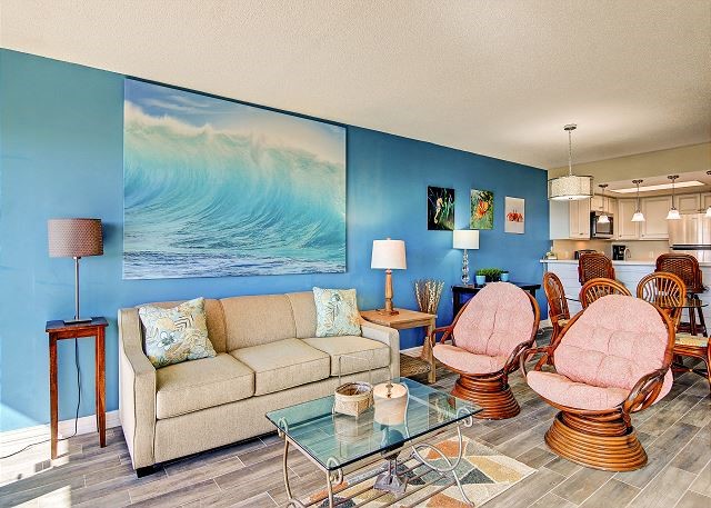 living room featuring hardwood / wood-style flooring and a textured ceiling