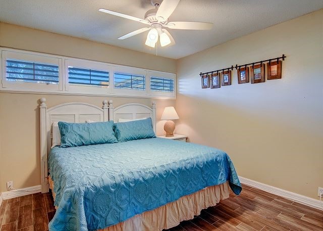 bedroom featuring ceiling fan and dark hardwood / wood-style floors