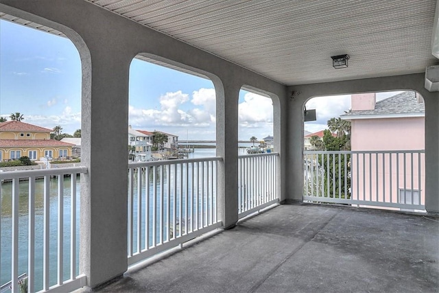 balcony featuring a water view