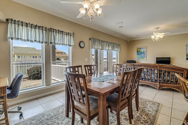 dining space featuring ornamental molding, ceiling fan, and light tile patterned floors