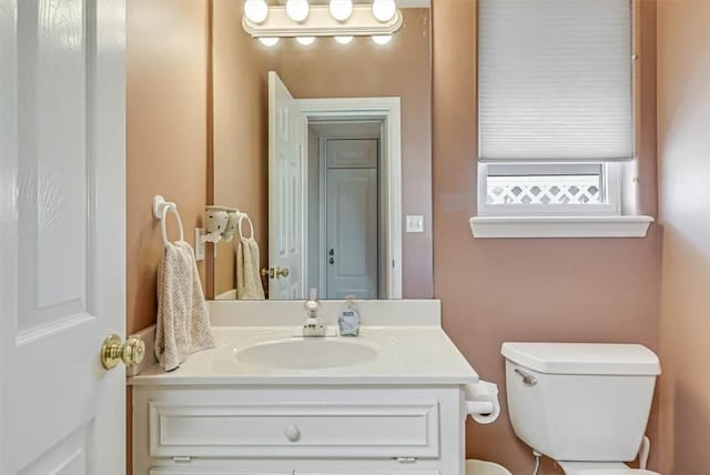 half bath with vanity and toilet