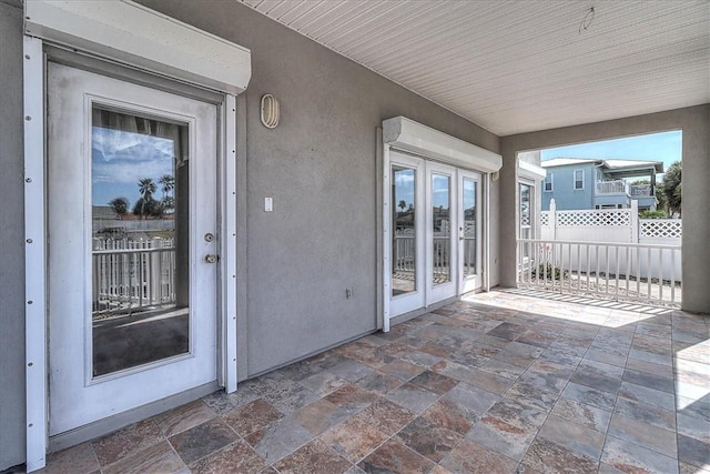 view of patio / terrace with french doors and fence