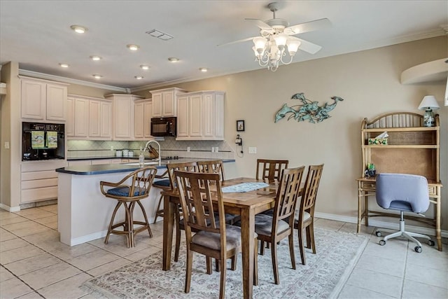 dining space with visible vents, crown molding, and light tile patterned floors