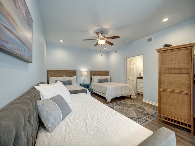 bedroom featuring hardwood / wood-style flooring and ceiling fan