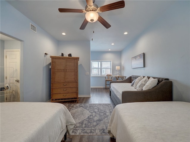 bedroom featuring dark wood-type flooring and ceiling fan