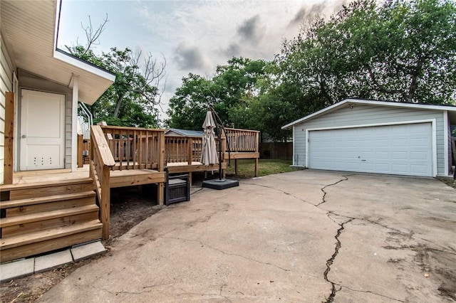 4001 Cott St, Corpus Christi, TX 78411 - view of patio with a detached garage, an outbuilding, and a deck