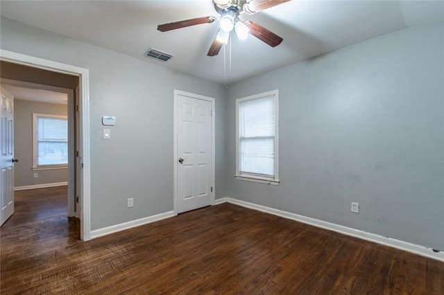 4001 Cott St, Corpus Christi, TX 78411 - unfurnished room with baseboards, dark wood-type flooring, and ceiling fan