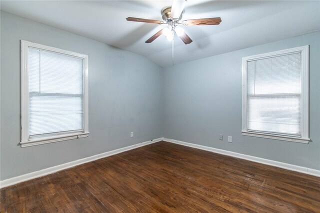 4001 Cott St, Corpus Christi, TX 78411 - unfurnished room featuring vaulted ceiling, baseboards, dark wood finished floors, and a ceiling fan